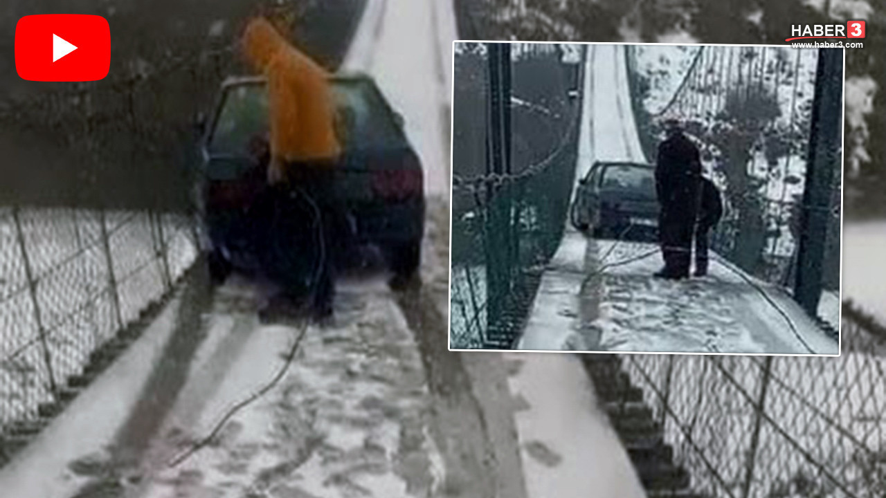 Metrelerce yükseklikteki asma köprüde korku dolu anlar! Buzda kayan otomobil asılı kaldı