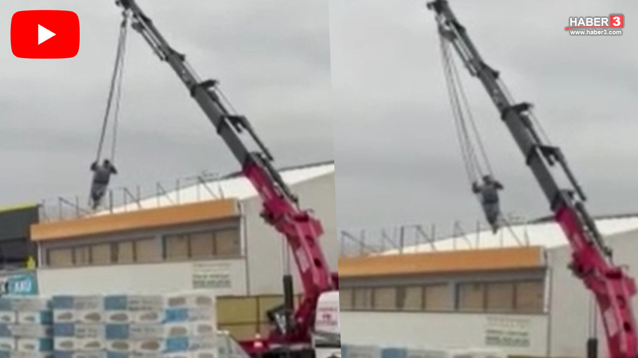 Ankara'nın Sincan ilçesinde dev bir vincin ucunda ip ile sallanan bir kişi.