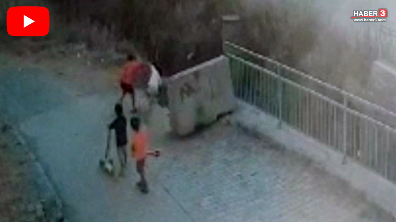 Arnavutköy'de otizmli bir çocuğun su kanalına itildiği anı gösteren güvenlik kamerası görüntüsü.